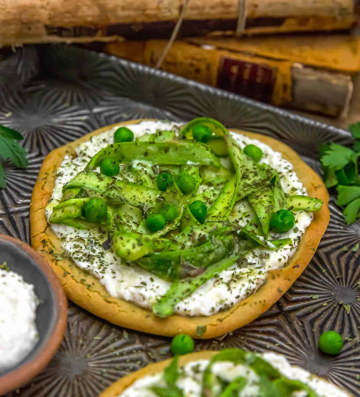 Close up of Vegan Asparagus Ricotta Flatbread Pizza