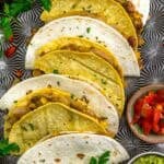 Close up of Smashed Pinto Bean and Grilled Onion Tacos