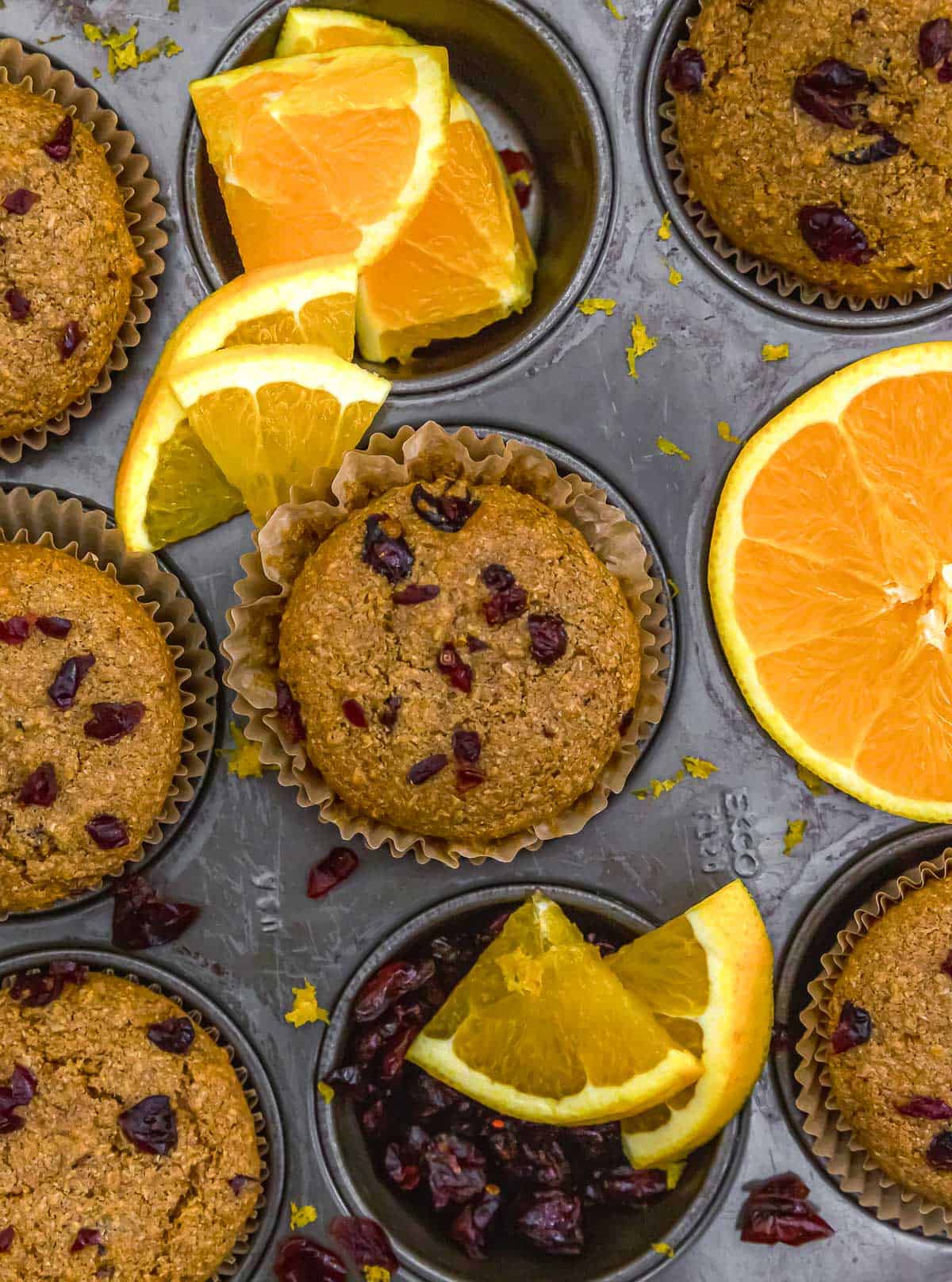 Healthy Orange Cranberry Wheat Bran Muffins in a muffin tin