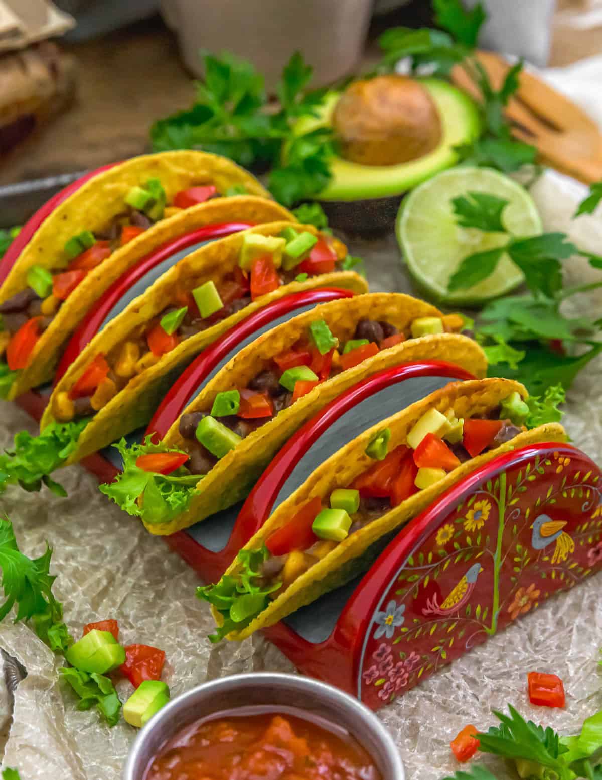 Easy Smoky Black Bean Corn Enchilada Tacos in a holder