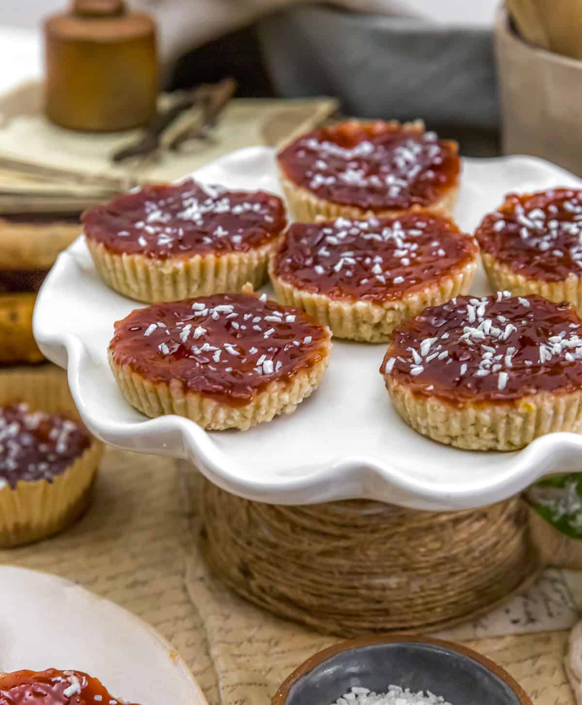 No-Bake Raspberry Coconut Treats on a cake stand