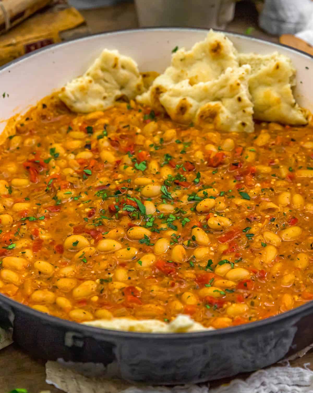 Close up of Smoky Brothy Bean Skillet