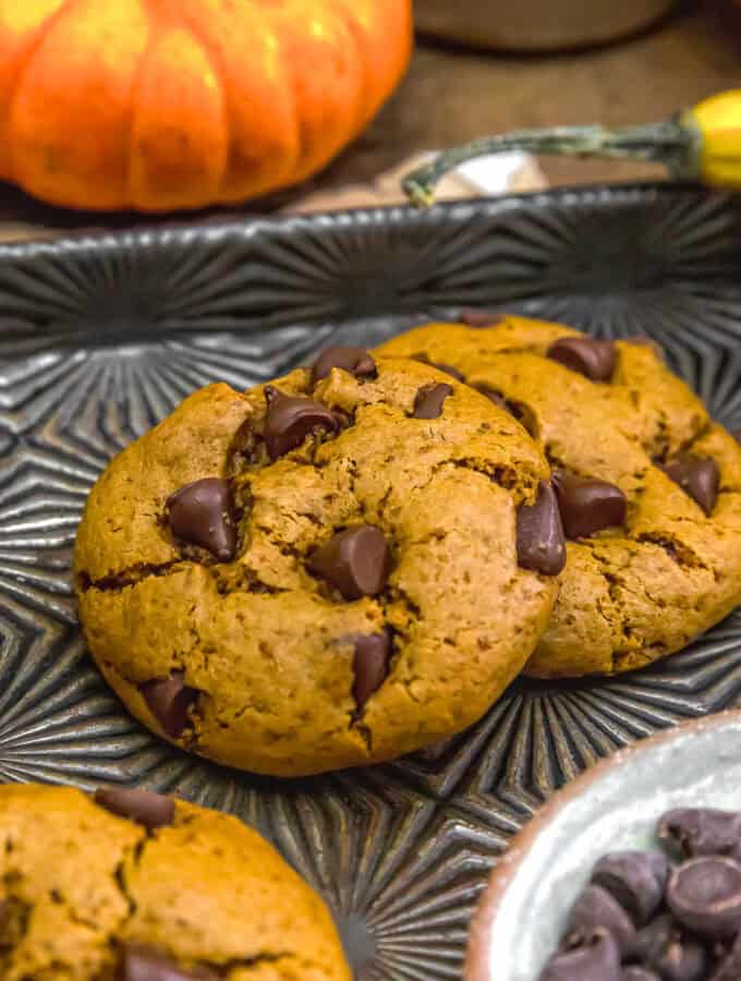 Two cookies of Vegan Healthy Pumpkin Chocolate Chip Cookies