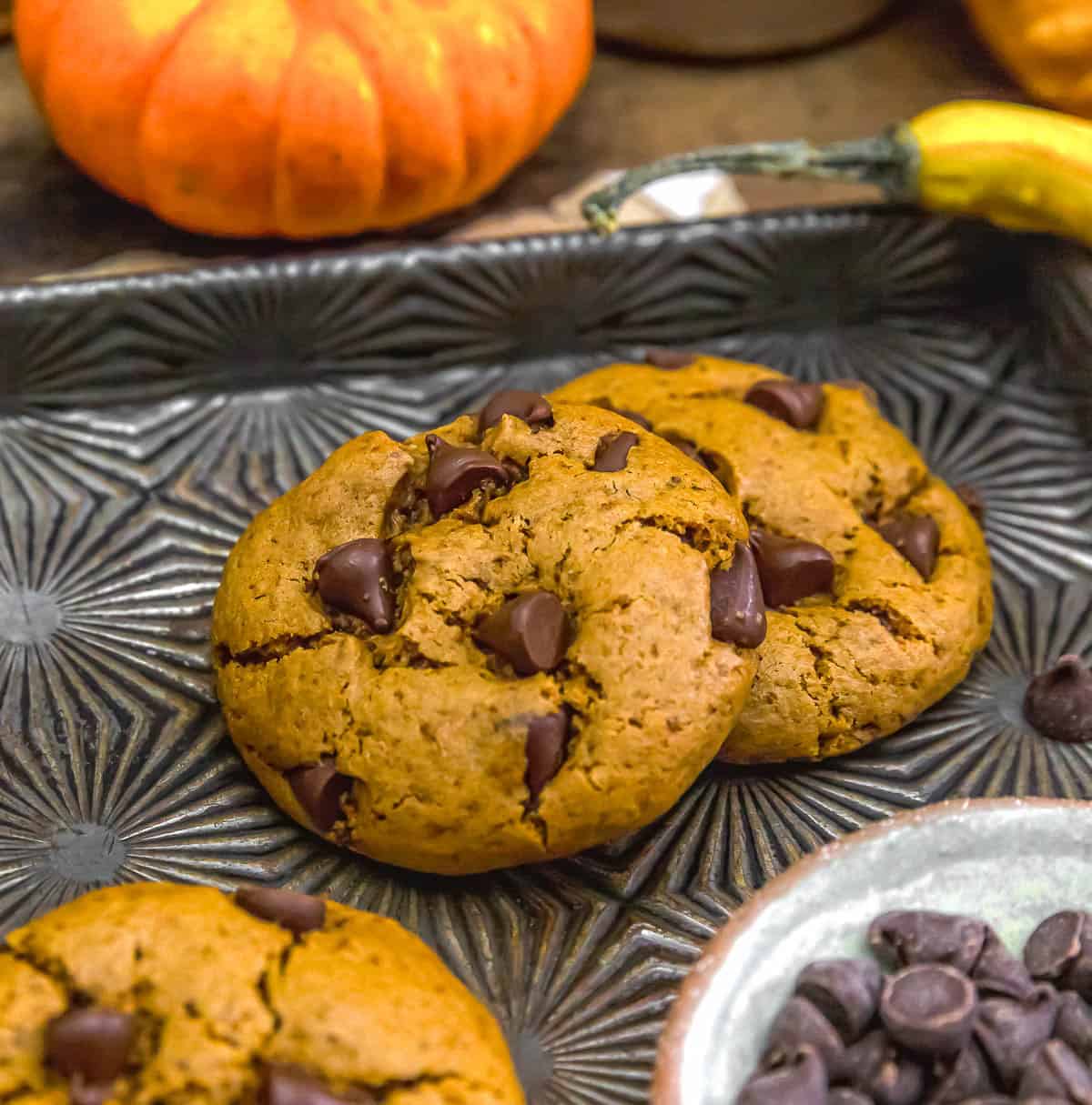 Two cookies of Vegan Healthy Pumpkin Chocolate Chip Cookies
